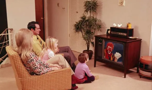 A family watching television in the 1970s