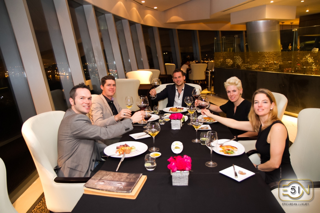 eon51 fine dining guest toasting luxury dinner