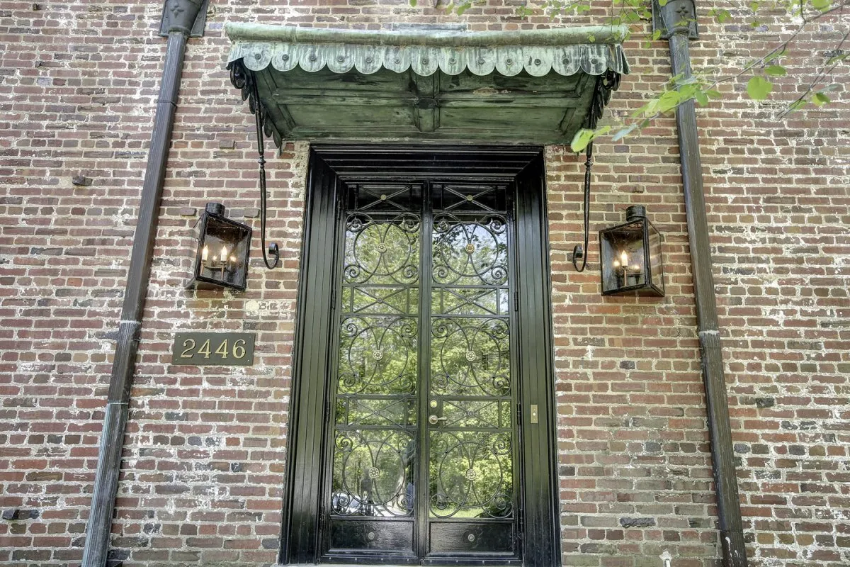 Fake gas lanterns flank the entrance.