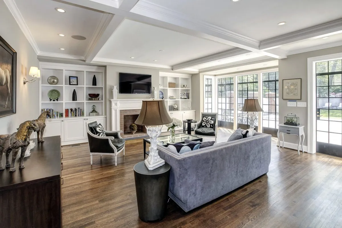 The family room has a wall of sunny windows overlooking the garden out back.