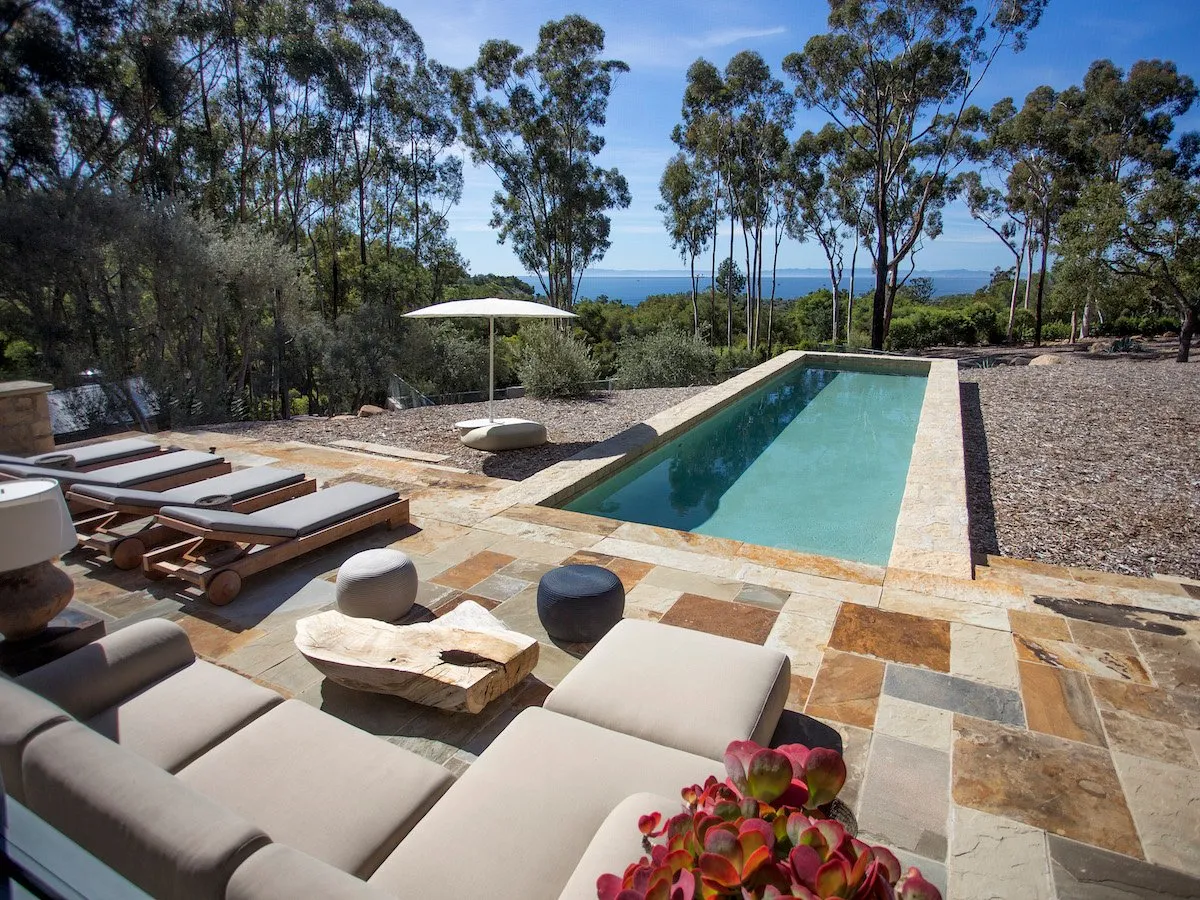 The pool overlooks the ocean.