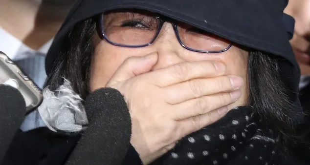 Choi Soon-sil, a cult leader's daughter with a decades-long connection to South Korean President Park Geun-hye, arrives at the Seoul Central District Prosecutors' Office in Seoul, South Korea, Monday, Oct. 31, 2016. The woman at the center of a scandal roiling South Korea met Monday with prosecutors examining whether she used her close ties to Park to pull government strings from the shadows and amass an illicit fortune. (Seo Myung-gon/Yonhap via AP)