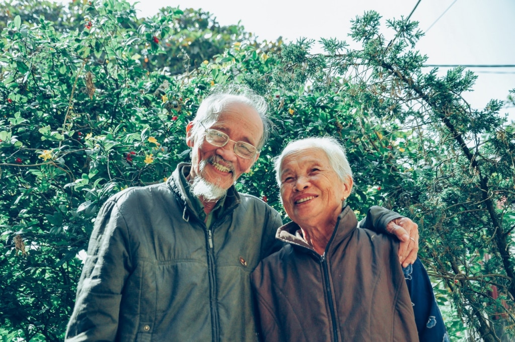 smiling man and woman wearing jackets 1642883