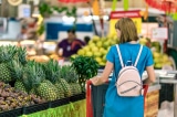 woman standing beside pineapple fruits 2292919