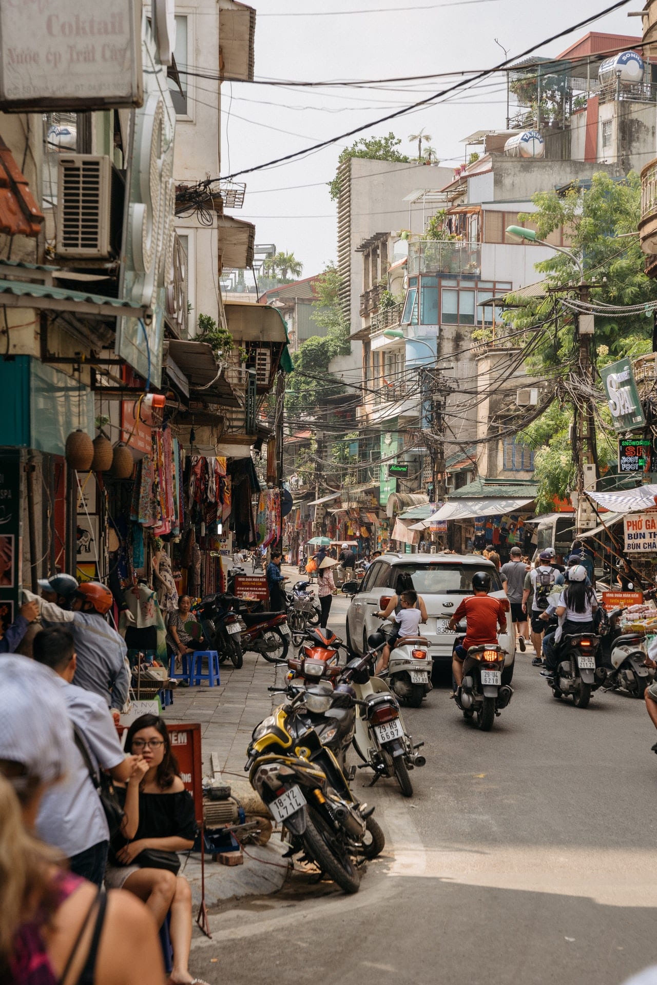 people sitting on sidewalk 1483778 image